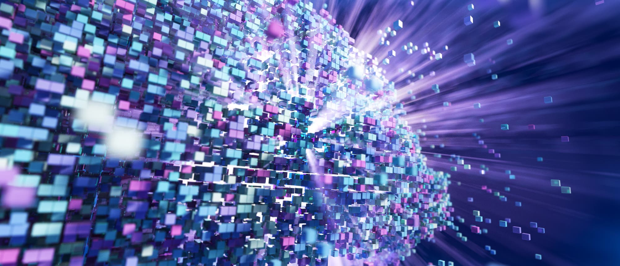 Eine dynamische 3D-Darstellung zeigt eine Vielzahl von bunten, schwebenden W&uuml;rfeln, die sich von einem zentralen Punkt aus in alle Richtungen ausbreiten. Die W&uuml;rfel sind in verschiedenen Blau-, Lila- und Rosat&ouml;nen gehalten und erzeugen einen Eindruck von Bewegung und Expansion. Der Hintergrund ist in einem verschwommenen Blau gehalten, was den Fokus auf die W&uuml;rfel verst&auml;rkt. Die Szene vermittelt ein Gef&uuml;hl von Technologie und Datenfluss.