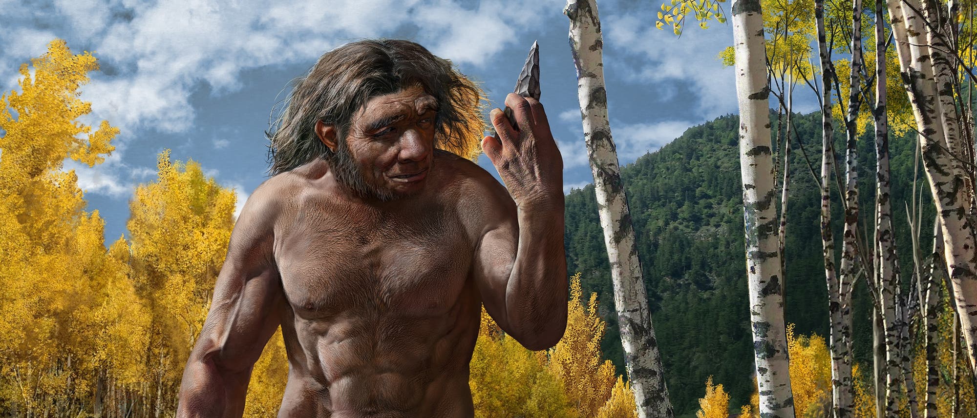 Ein prähistorischer Mensch steht in einem Wald mit herbstlich gefärbten Bäumen und hält ein Steinwerkzeug in der Hand. Er trägt einen Fellrock und steht auf einem Felsen in einem flachen Bach. Im Hintergrund sind Birken und ein bewaldeter Hügel zu sehen. Die Szene vermittelt ein Bild aus der Steinzeit.