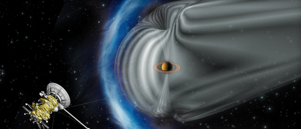 Raumsonde Cassini mit Saturn-Magnetosphäre (künstlerische Darstellung)