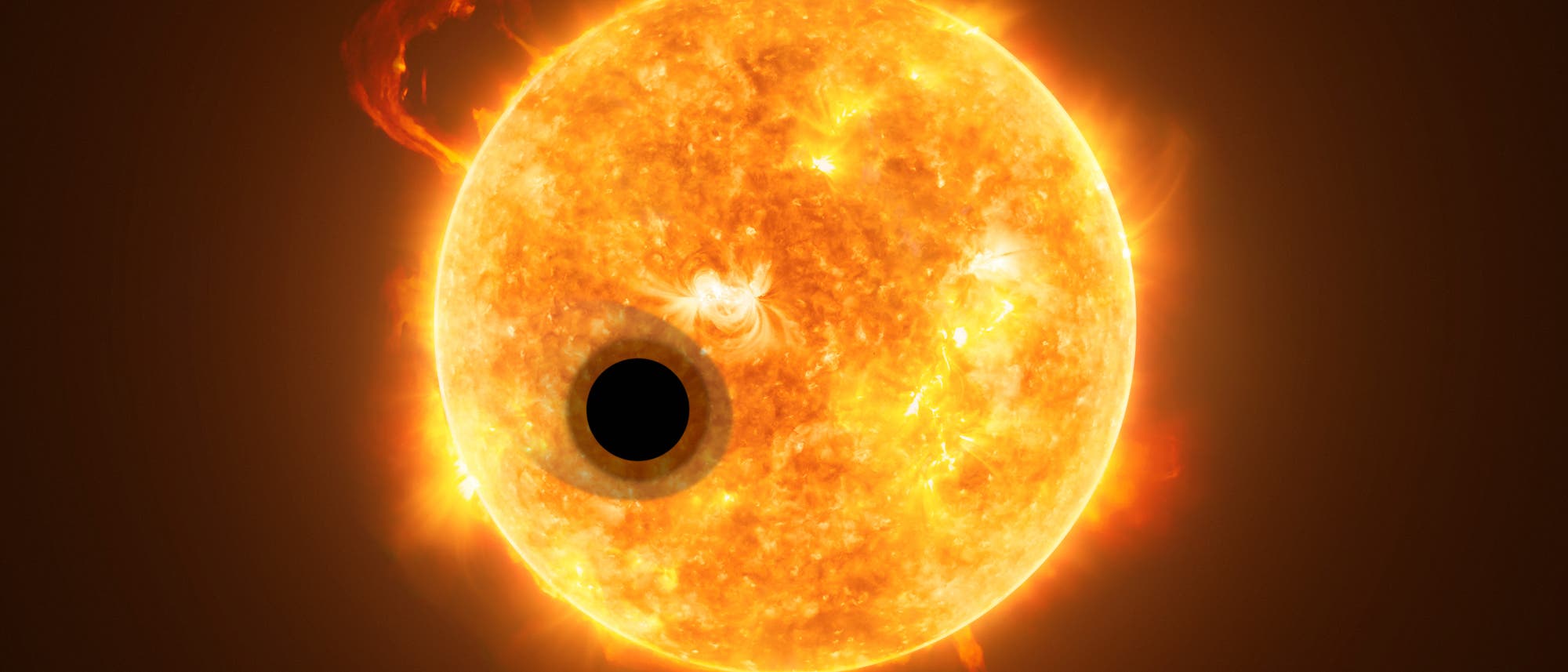Die künstlerische Darstellung zeigt Exoplanet WASP-107b und seinen Stern, WASP-107. Ein Teil des Lichts des Sterns strömt durch die ausgedehnte Gasschicht des Exoplaneten.