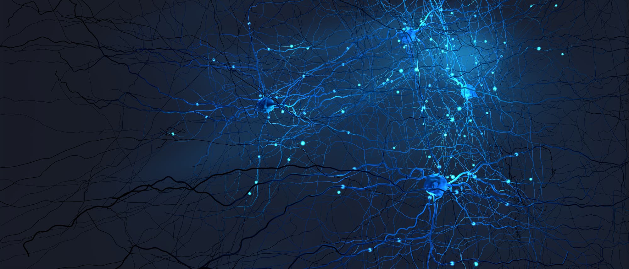Blaue Neurone vor schwarzem Hintergrund