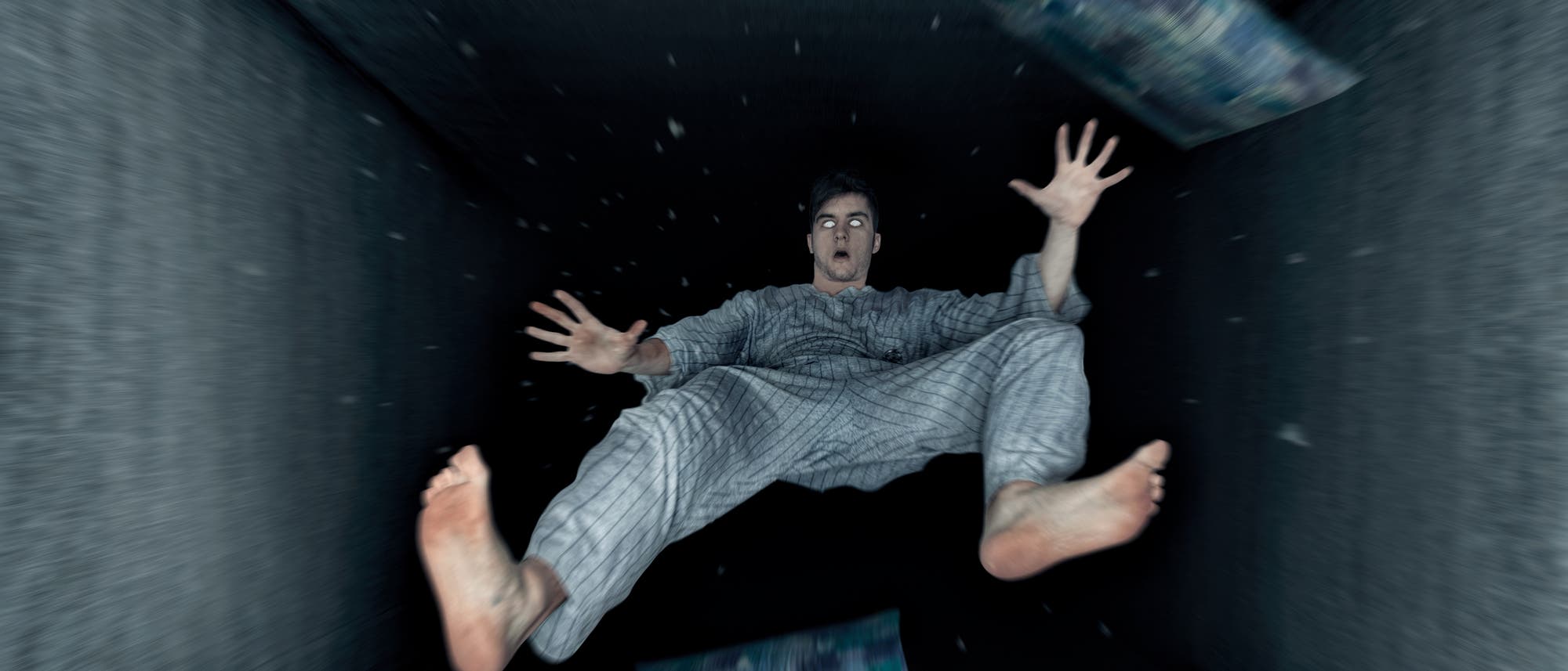 Ein Mann im Pyjama fällt mit Decke und Kissen in einen schwarzen Schacht.