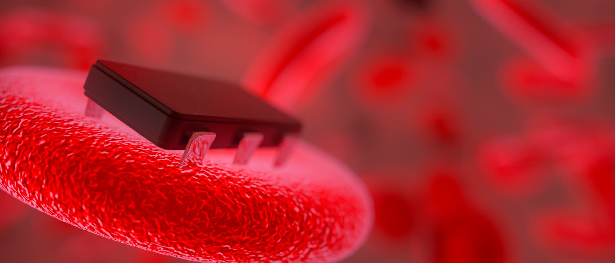 Bioimplantat-Fantasie: Ein rotes Blutkörperchen trägt eine Art Chip. Wichtig scheint auch hier eine funktionierende Schnittstelle zwischen Elektronik und Biologie zu sein. 