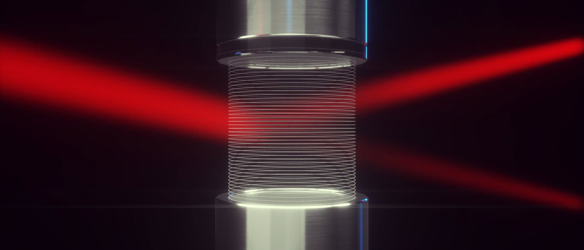 Ein Laserlichtstrahl läuft zwischen einer Lautsprecher-Reflektor-Anordnung hindurch, die ein Gitter aus Luft erzeugt