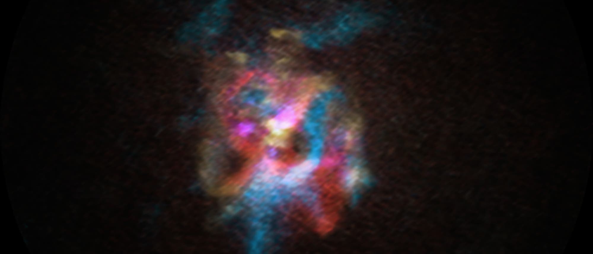 Una imagen astronómica de color muestra una nube ligera de gas y polvo en el espacio. La nube consta de diferentes colores, incluidos azules, rojos y rosas, que se distinguen en un fondo oscuro. Estos colores podrían indicar diferentes composiciones químicas o temperaturas dentro de la nube. La imagen da la impresión de movimiento y dinámica en el universo. Una imagen astronómica de color muestra una nube ligera de gas y polvo en el espacio. La nube consta de diferentes colores, incluidos azules, rojos y rosas, que se distinguen en un fondo oscuro. Estos colores podrían indicar diferentes composiciones químicas o temperaturas dentro de la nube. La imagen da la impresión de movimiento y dinámica en el universo.