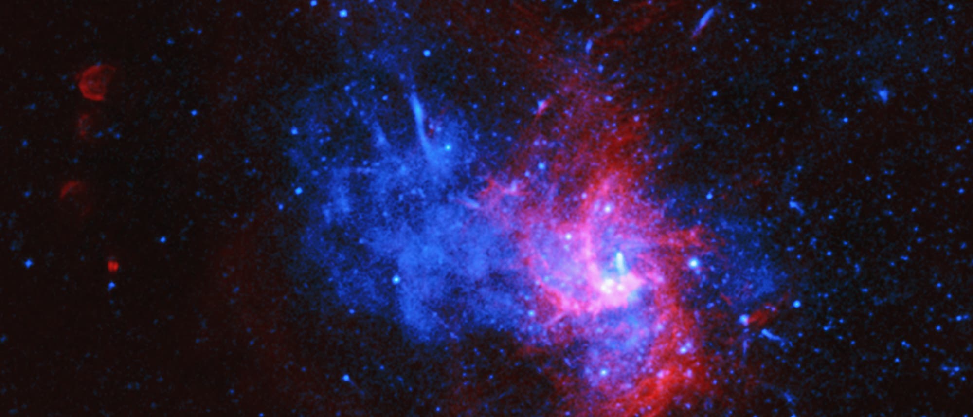 Zentrum der Milchstraße (Röntgenstrahlen blau, Radiowellen rot)