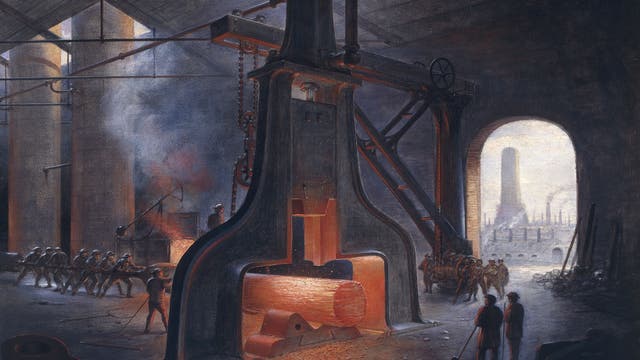 Bild einer Stahlfabrik, in der Männer mit einem großen dampfbetriebenen Schmiedehammer einen Stahlblock bearbeiten.