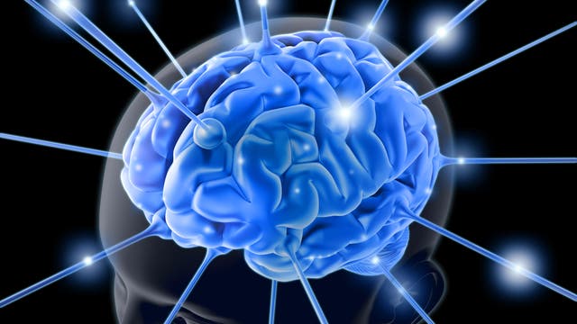 Illustration eines Kopfes von oben, man sieht das Hirn in blau, mehrere blaue Strahlen zielen auf das Gehirn und symbolisieren eine Hirnstimulation.