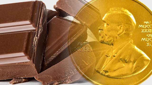 Schokoladenstücke mit der Nobel-Medaille überblendet. 
