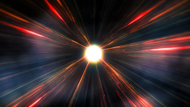 Eine künstlerische Darstellung eines astronomischen Phänomens, das an eine Supernova oder einen Lichtausbruch im Weltraum erinnert. Ein heller, leuchtender Punkt in der Mitte strahlt bunte Lichtstrahlen in Rot-, Orange- und Blautönen aus, die sich radial nach außen erstrecken. Der Hintergrund ist dunkel, was den Kontrast zu den leuchtenden Farben verstärkt.