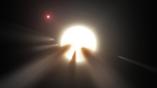 Der Stern KIC 8462852 gibt den Forschern Rätsel auf: Worin könnte die Ursache der unregelmäßigen Verfinsterungen liegen? Kometen oder planetare Kleinkörper, wie in dieser künstlerischen Darstellung, bieten jedenfalls keine plausible Erklärung.