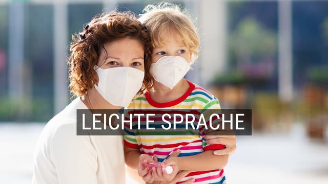 Frau und Kind tragen Masken zum Schutz vor Infektion
