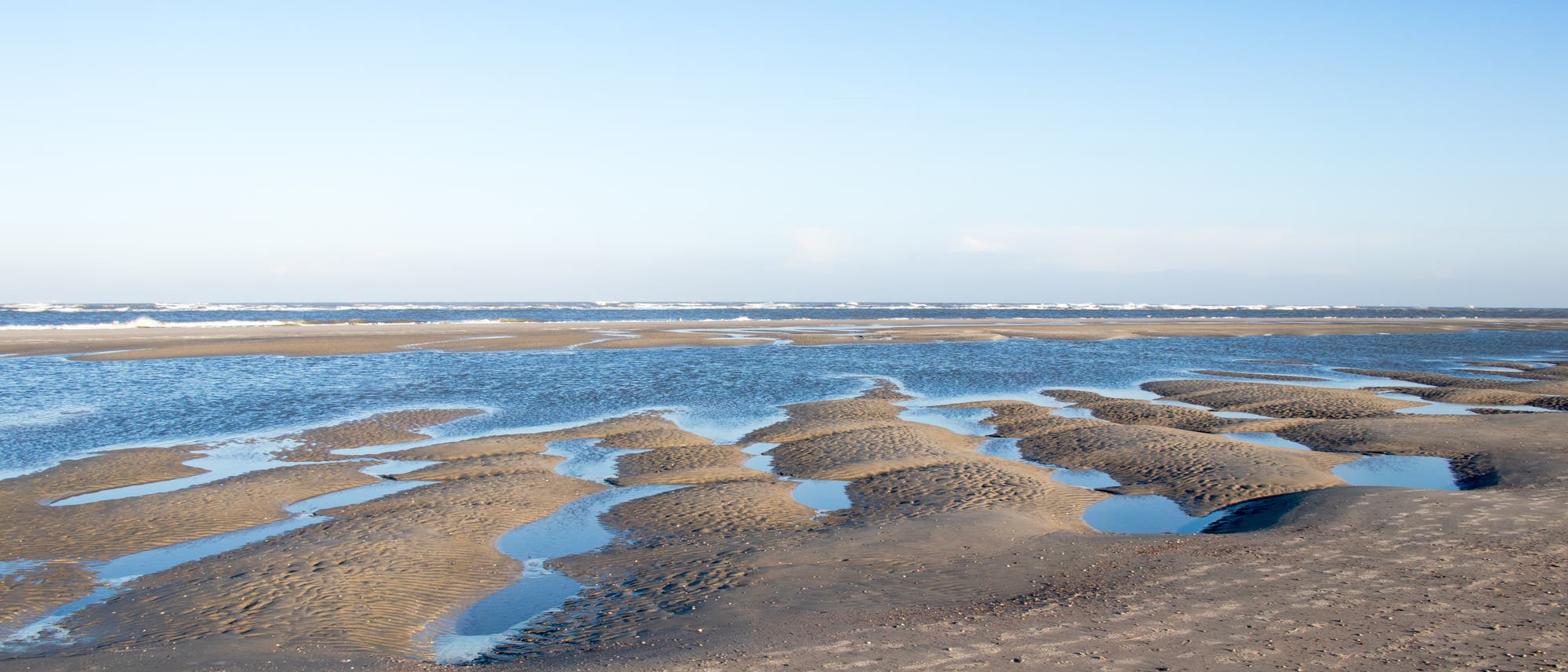 Wattenmeer bei Ebbe auf der ostfriesischen Insel Spiekeroog Wattenmeer bei Ebbe auf der ostfriesischen Insel Spiekeroog