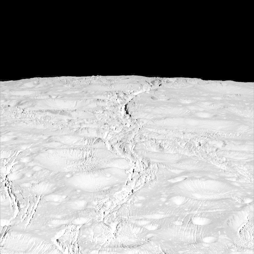 Der Nordpol von Enceladus wird von tiefen Kratern und Spalten geprägt. Der Nordpol von Enceladus wird von tiefen Kratern und Spalten geprägt.